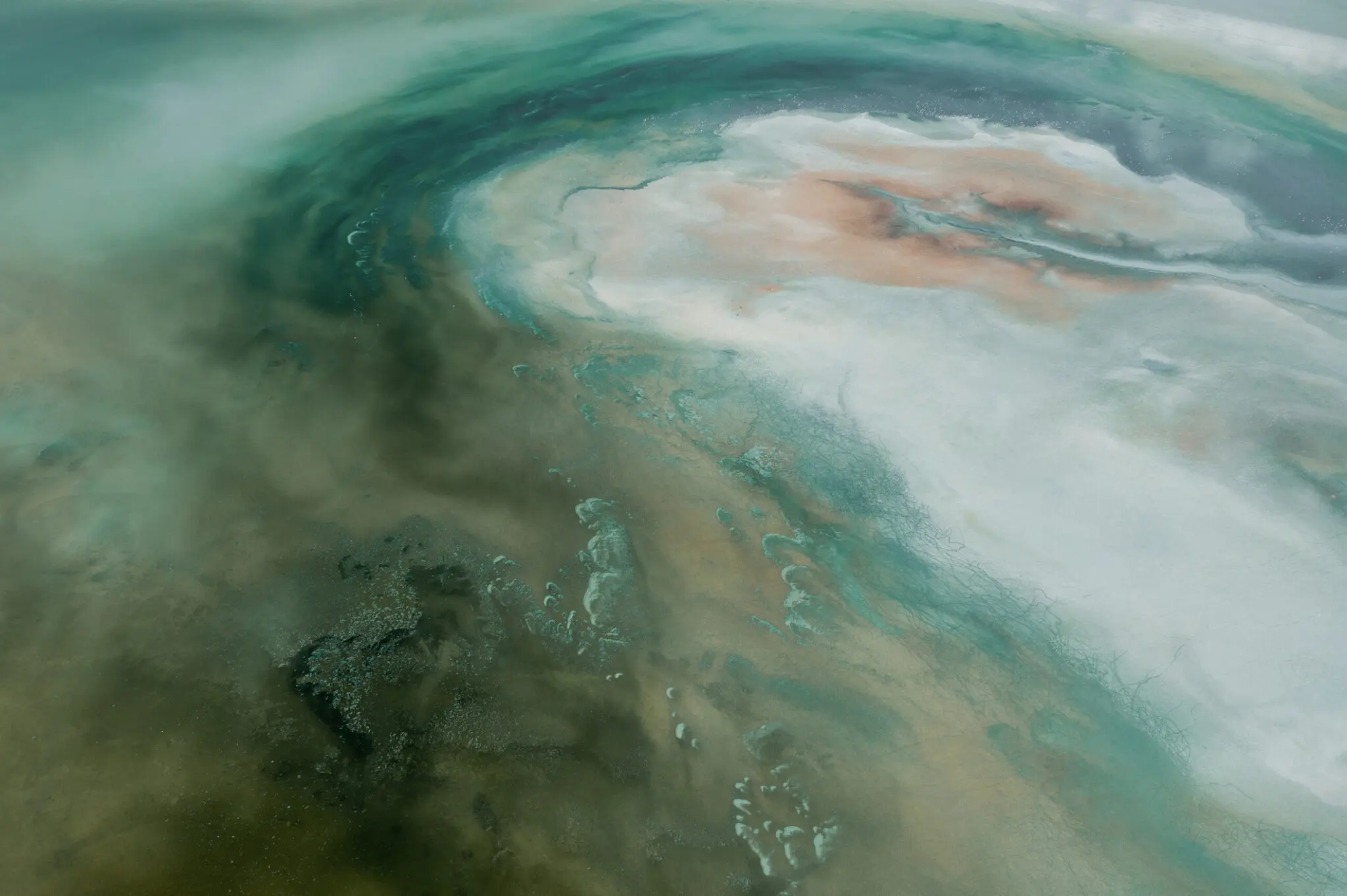 Aerial view of turquoise and beige salt lake