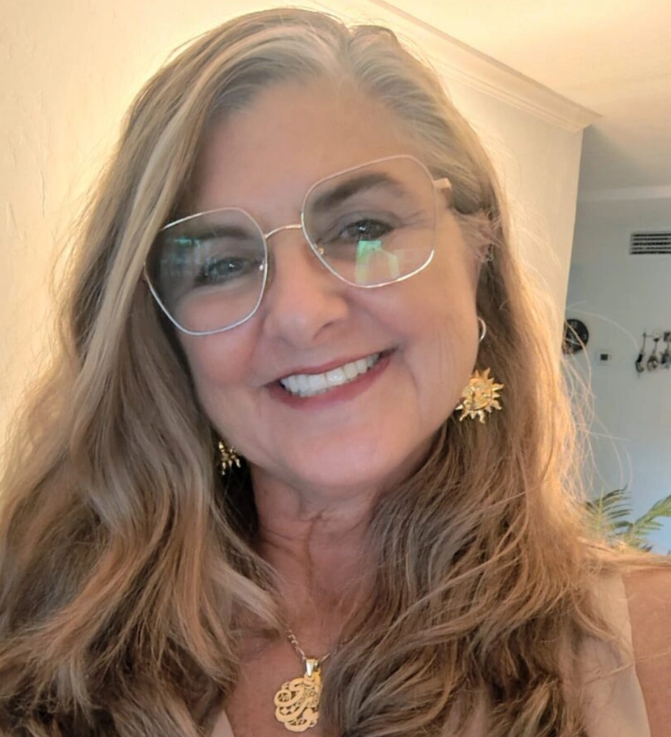Smiling woman with glasses and long hair